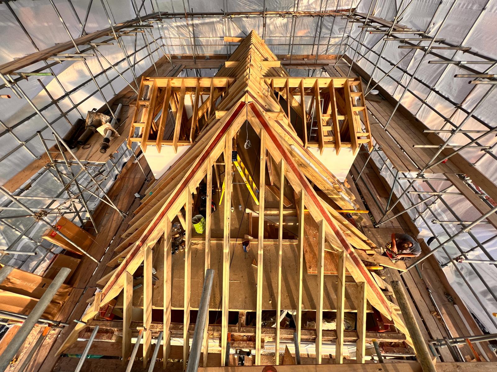 Timber framing being built into a roof structure